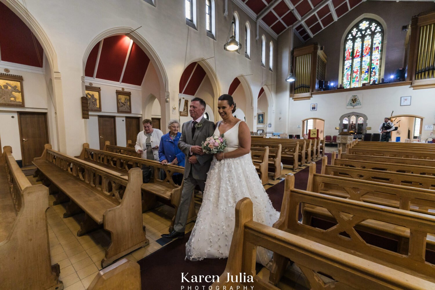 bride walking down the aisle with her dad to meet her groom