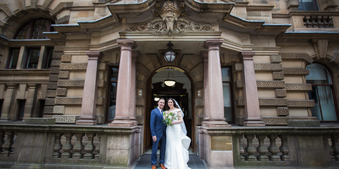 bride and groom portrait outside 23 Montrose Street on their wedding day