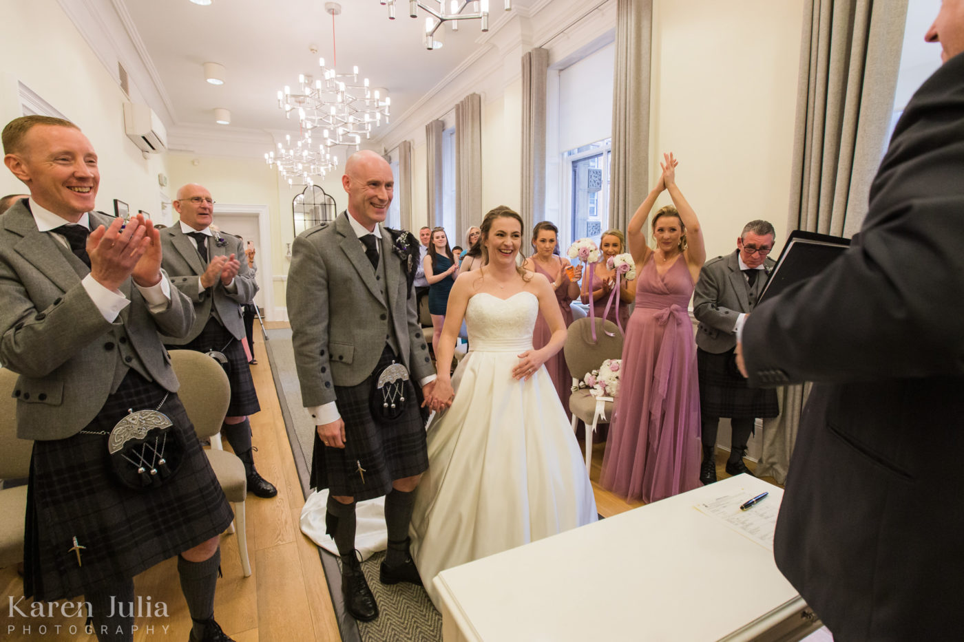 bride and groom during their wedding ceremony in the Kelvin Room