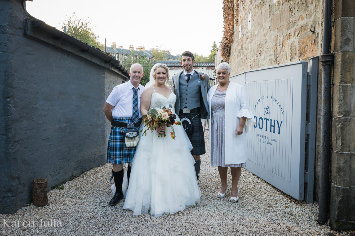wedding party group photo at the bothy with parents