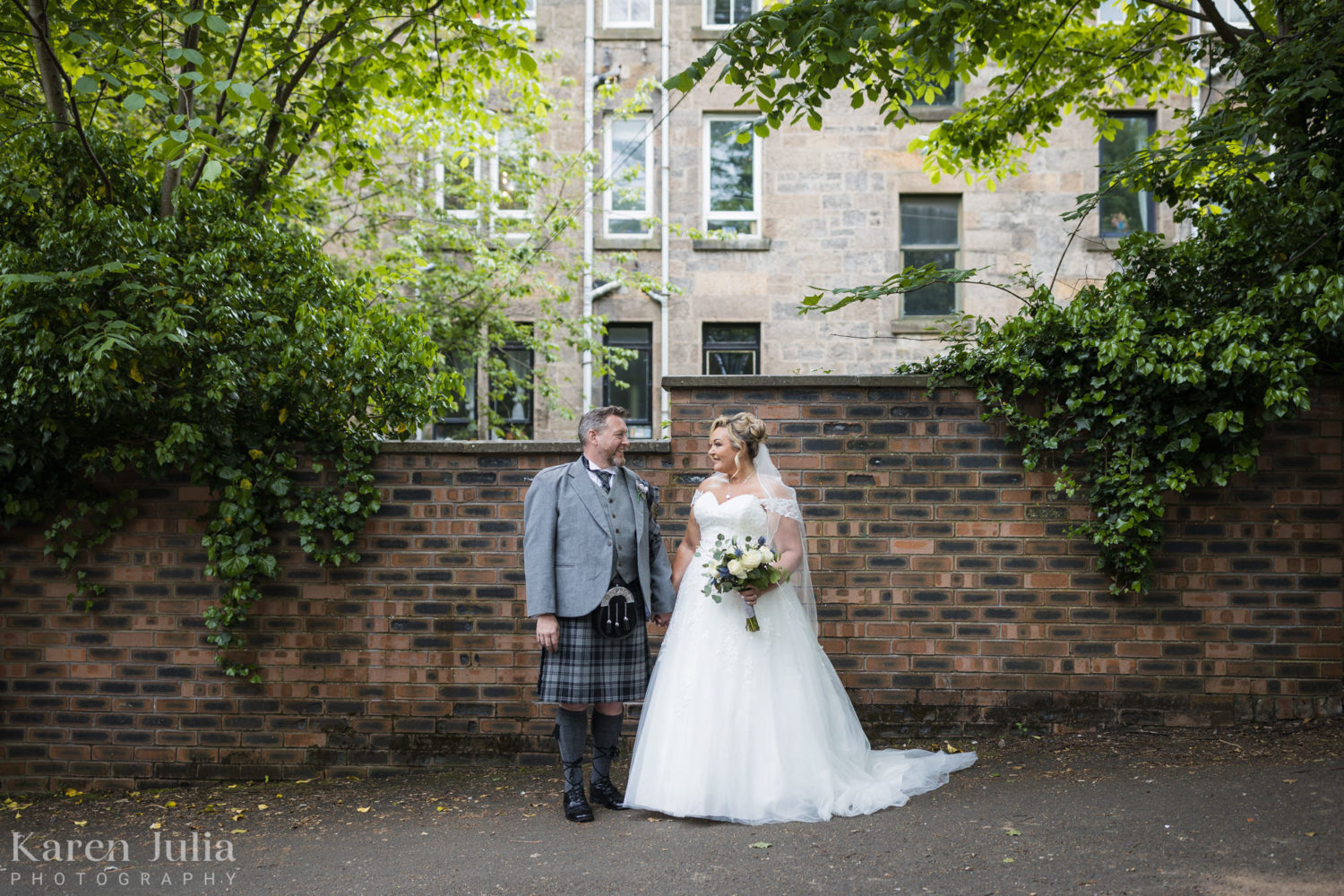 bride and groom portrait in Partickhill Rd at the side of Cottiers