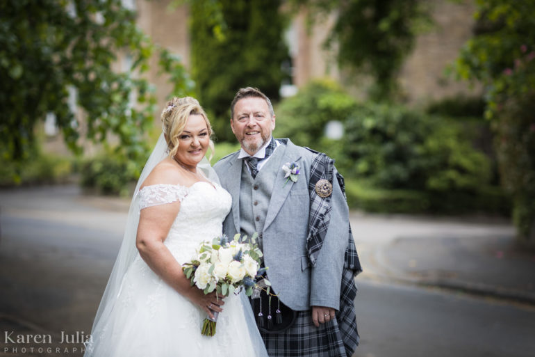 bride and groom portrait outside Cottiers on their wedding day