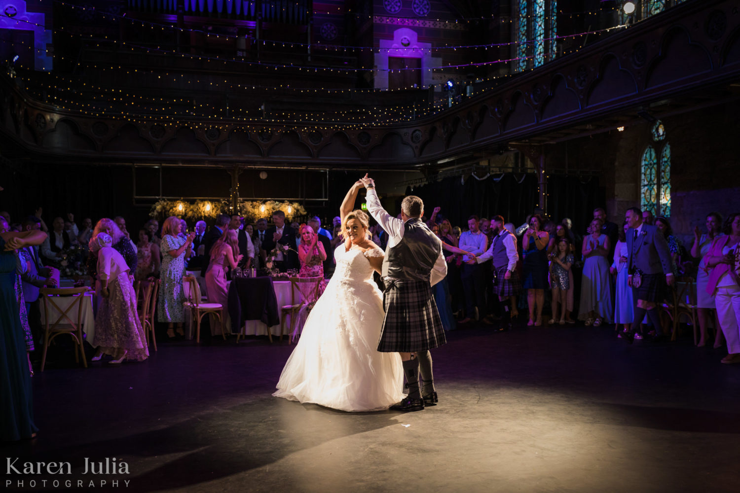 bride and groom on the dancefloor during their wedding at Cottiers
