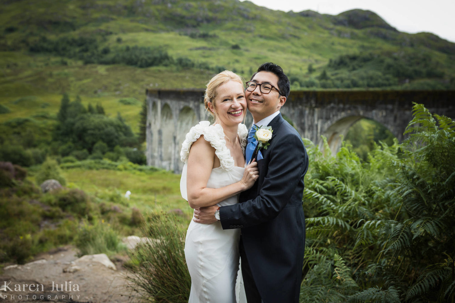 bride and groom portrait in front of the Glenfinnan Viaduct