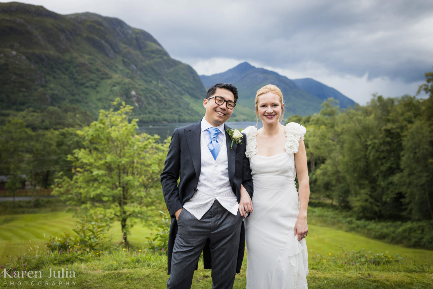 bride and groom couple portrait with Loch Shiel in the background