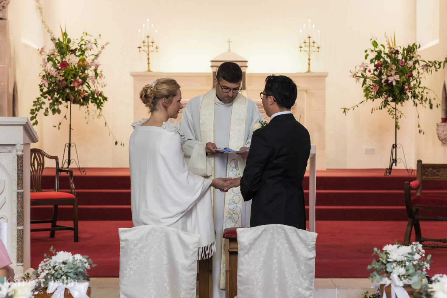 bride and groom exchanging vows during the wedding ceremony