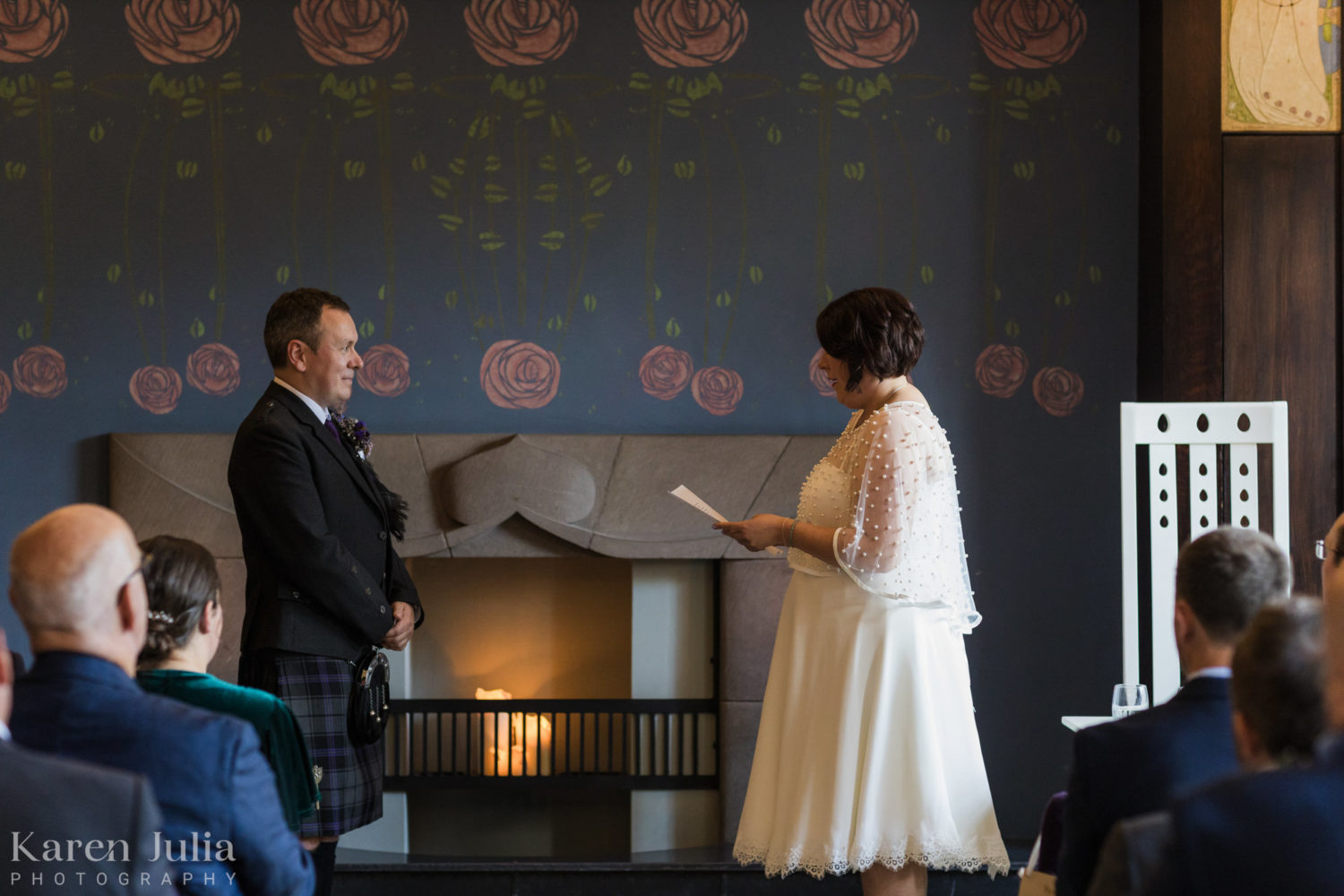 bride reads vows to groom during wedding ceremony at House for an Art Lover