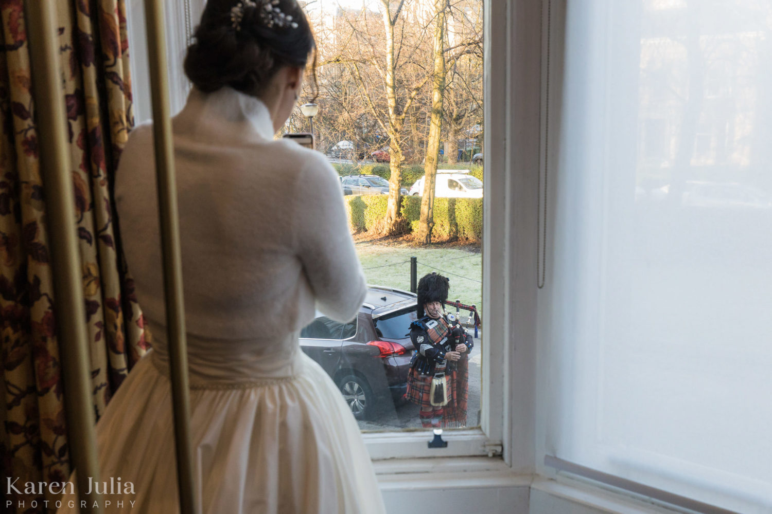 bride looks out of the window to see surprise piper