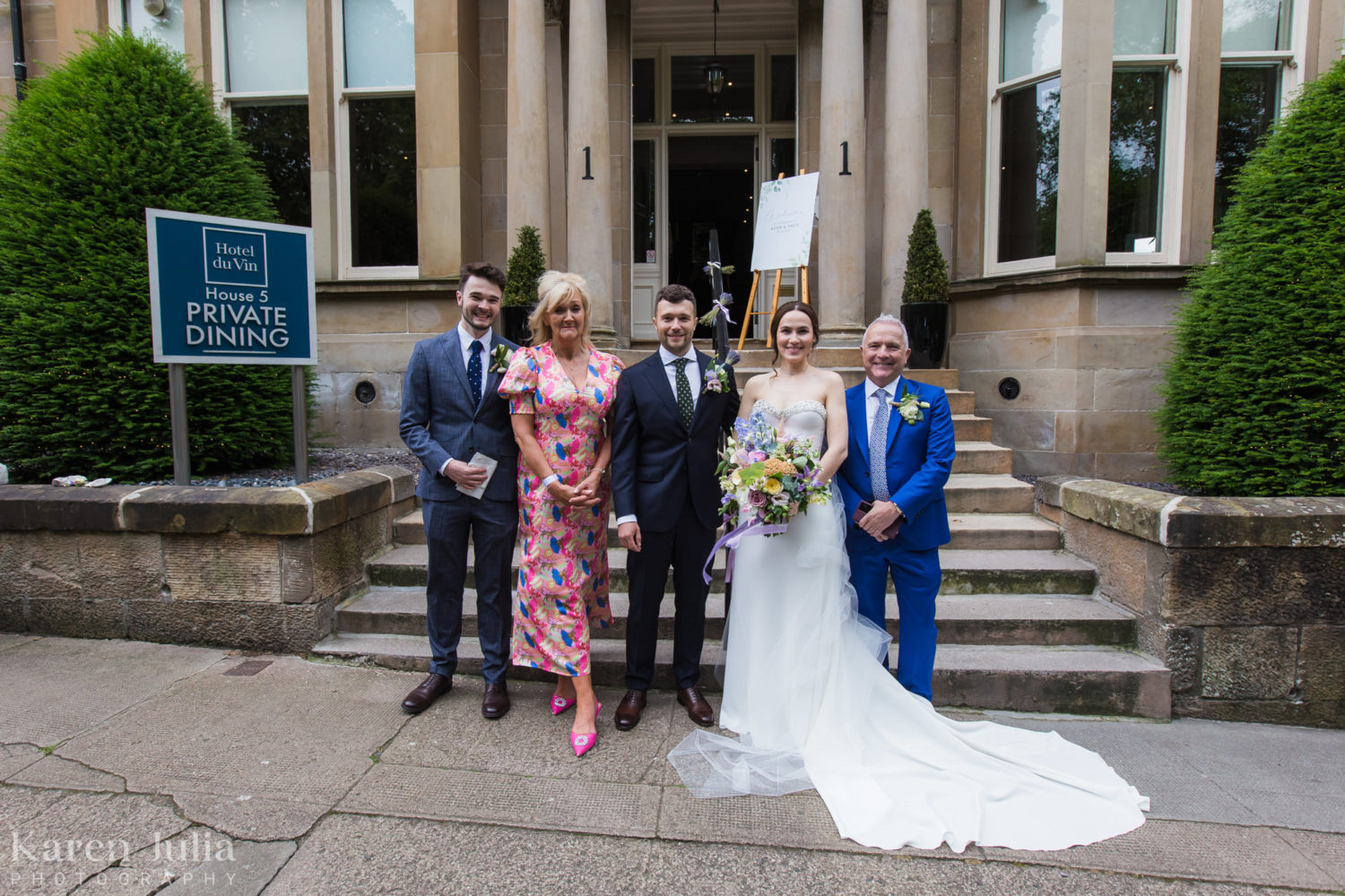 wedding group photos with family on the stairs at One Devonshire Gardens