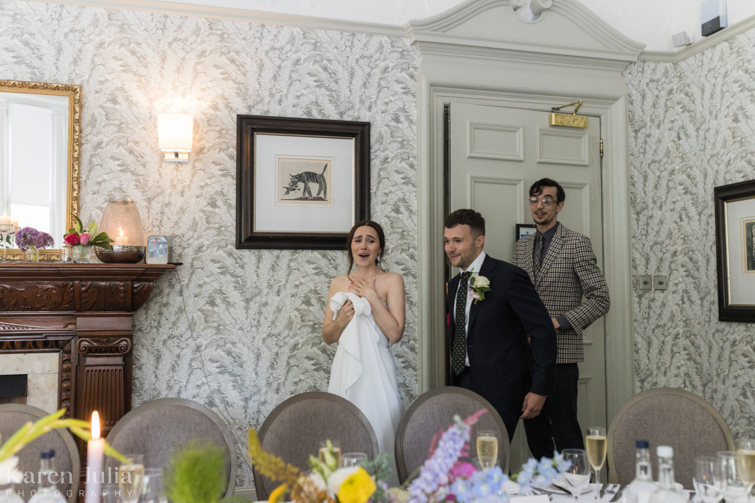 bride and groom see the wedding breakfast room for the first time and are overcome with emotion