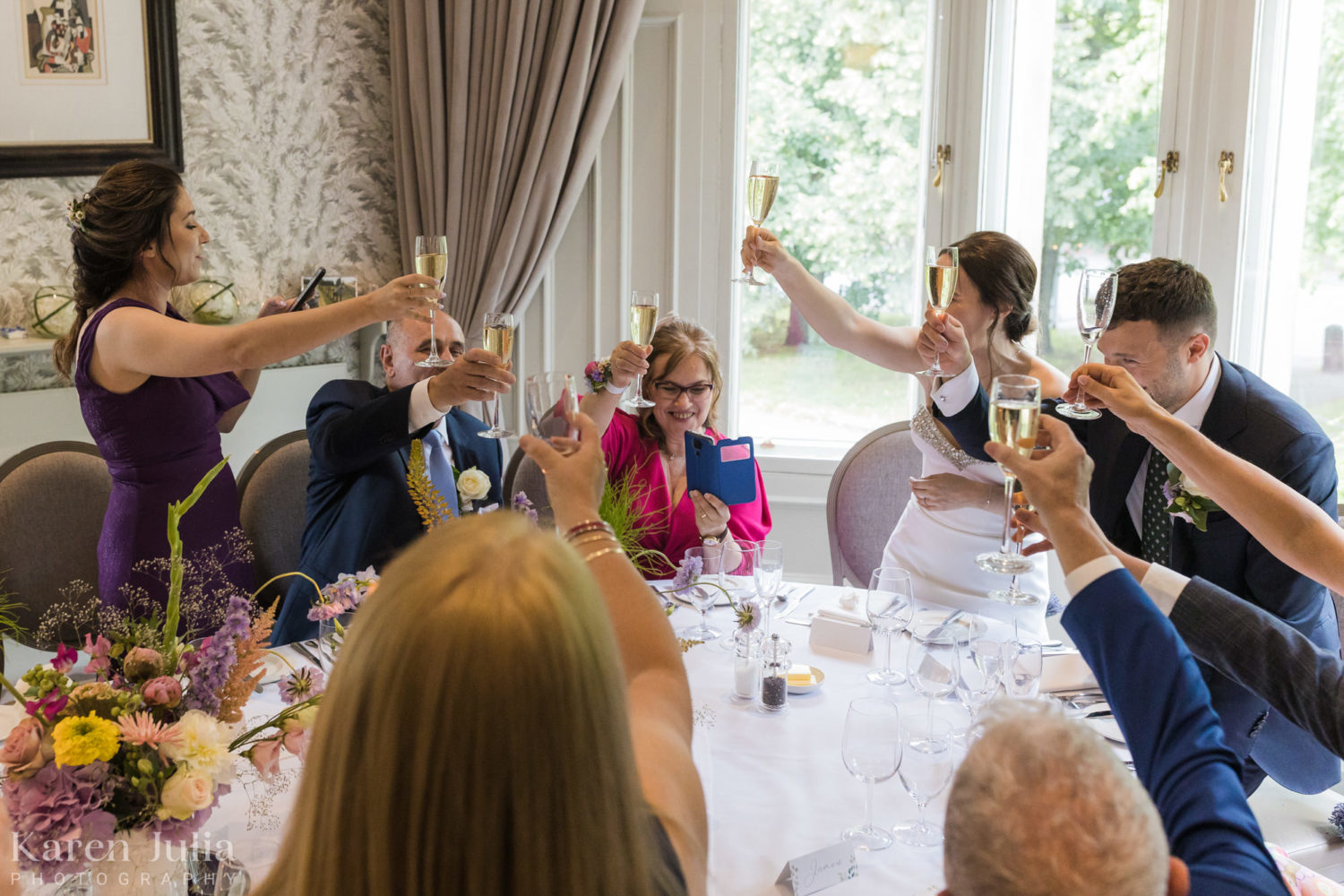 guests raise another toast to bride and groom