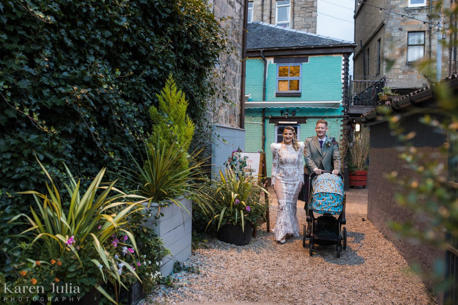 bride and groom arriving at the Bothy garden for the wedding reception