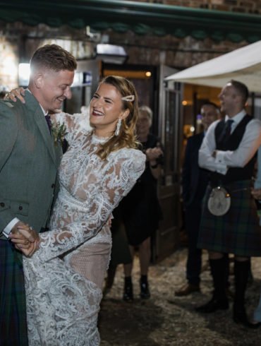 bride and groom dance in the Bothy garden on their wedding day