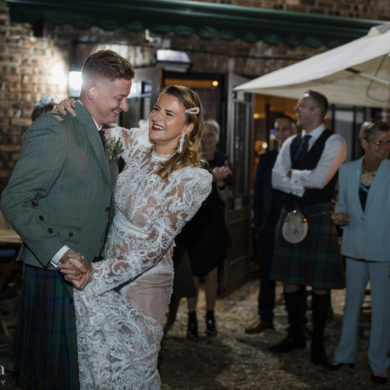 bride and groom dance in the Bothy garden on their wedding day