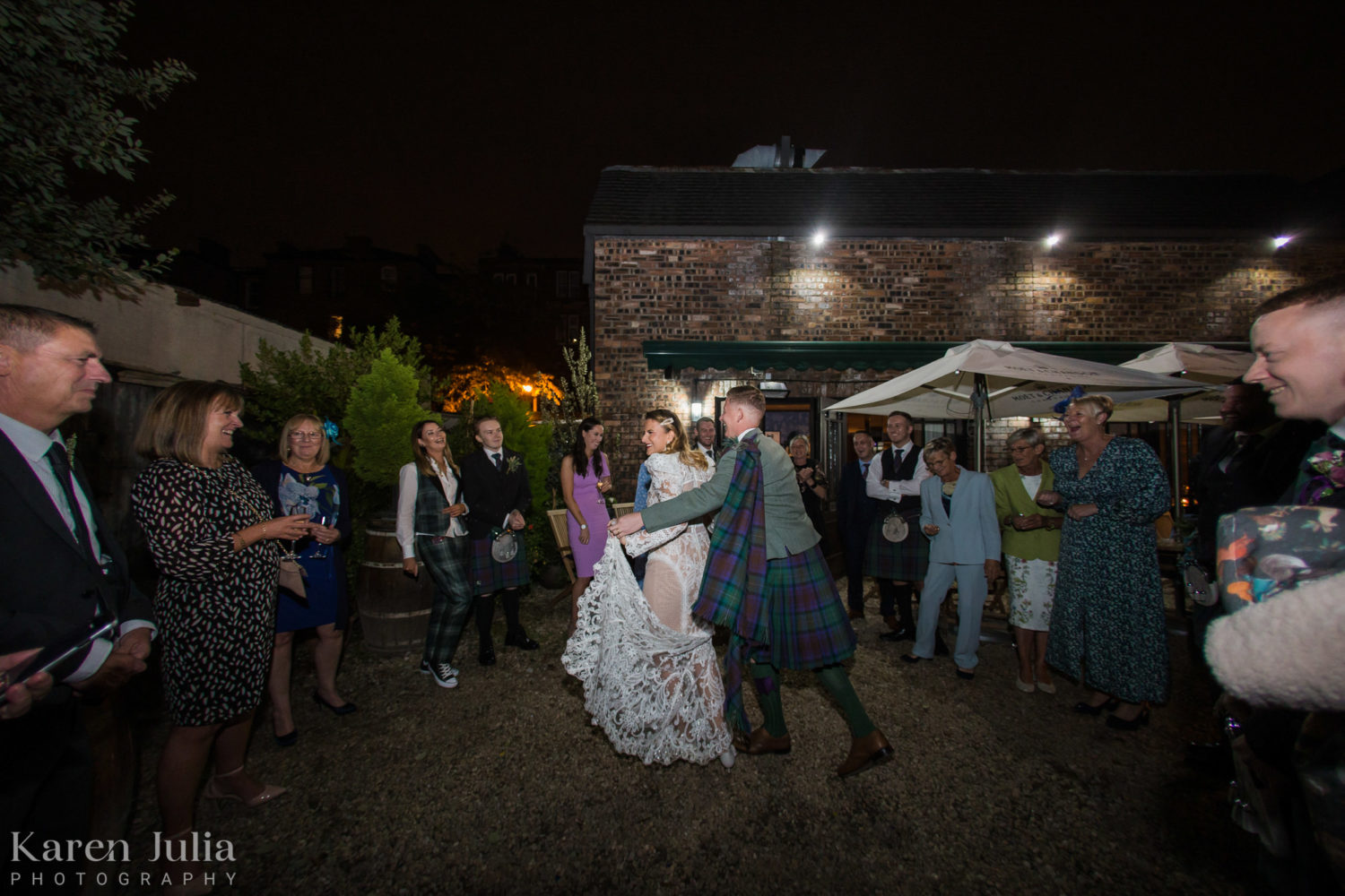 bride and groom dancing in the Bothy garden
