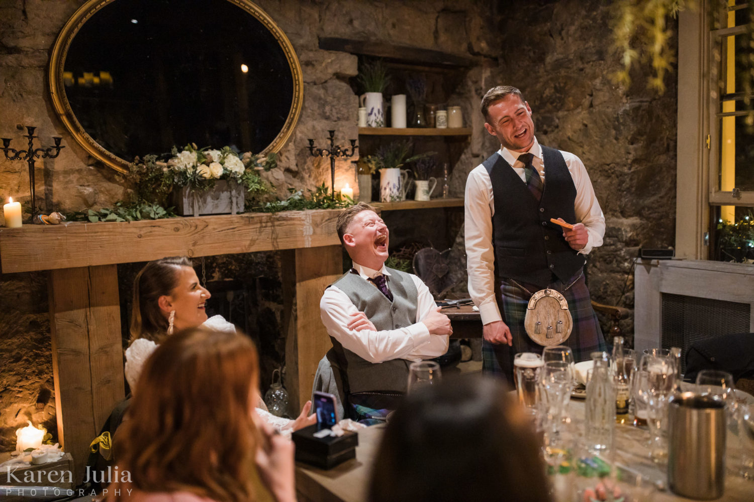 best man makes a speech to the wedding party in the Scullery