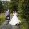 bride and groom walk along the canalside path at the Engine Works on their wedding day