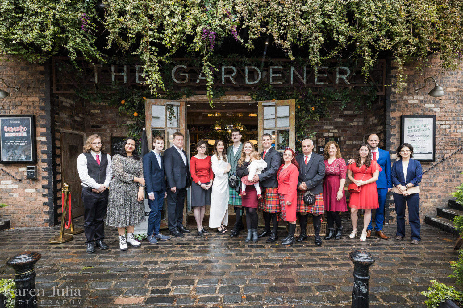 wedding party group photo outside The Gardener