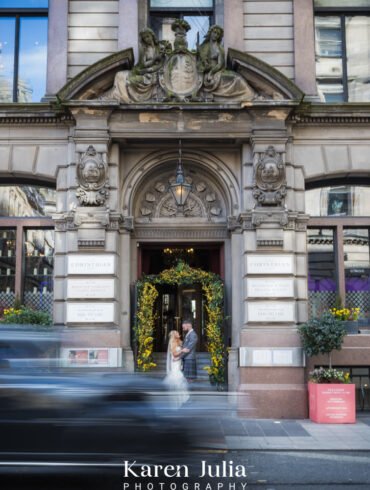 bride and groom portrait ouutside the Corinthian Club on their wedding day