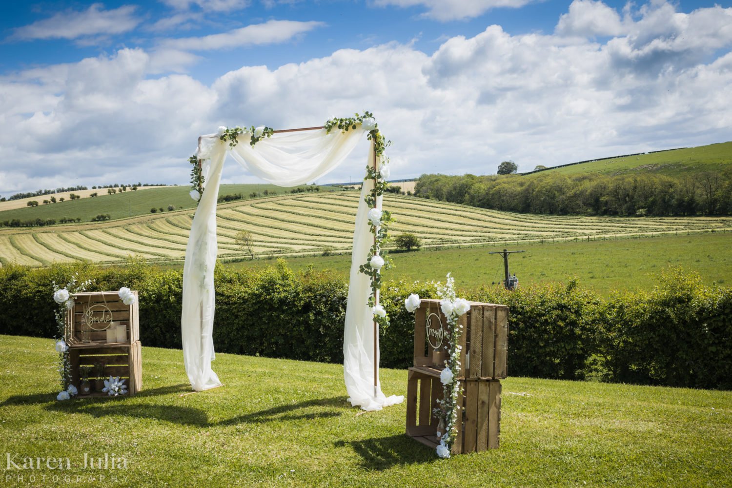 Barwheys set up for an outdoor wedding ceremony