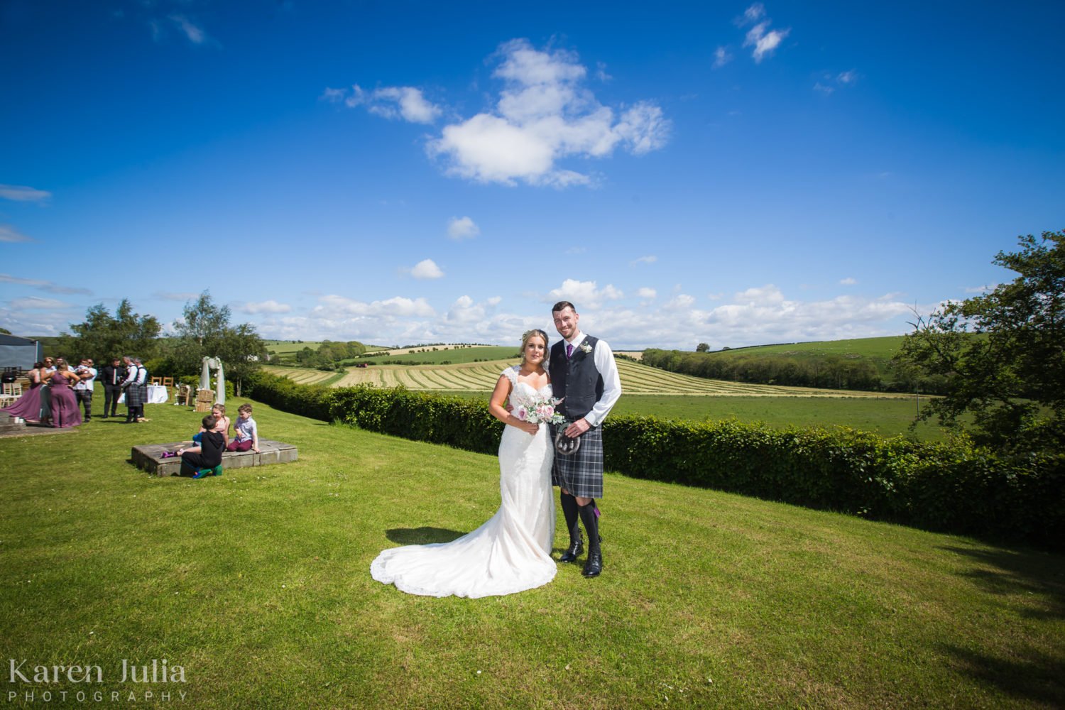 bride and groom portrait in front of the scenic hillside at Barwheys