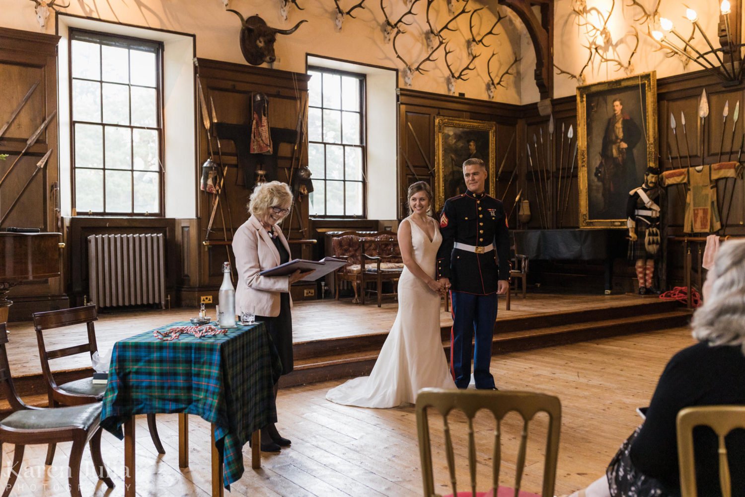 celebrant shares the couples story with wedding guests at Blair Castle