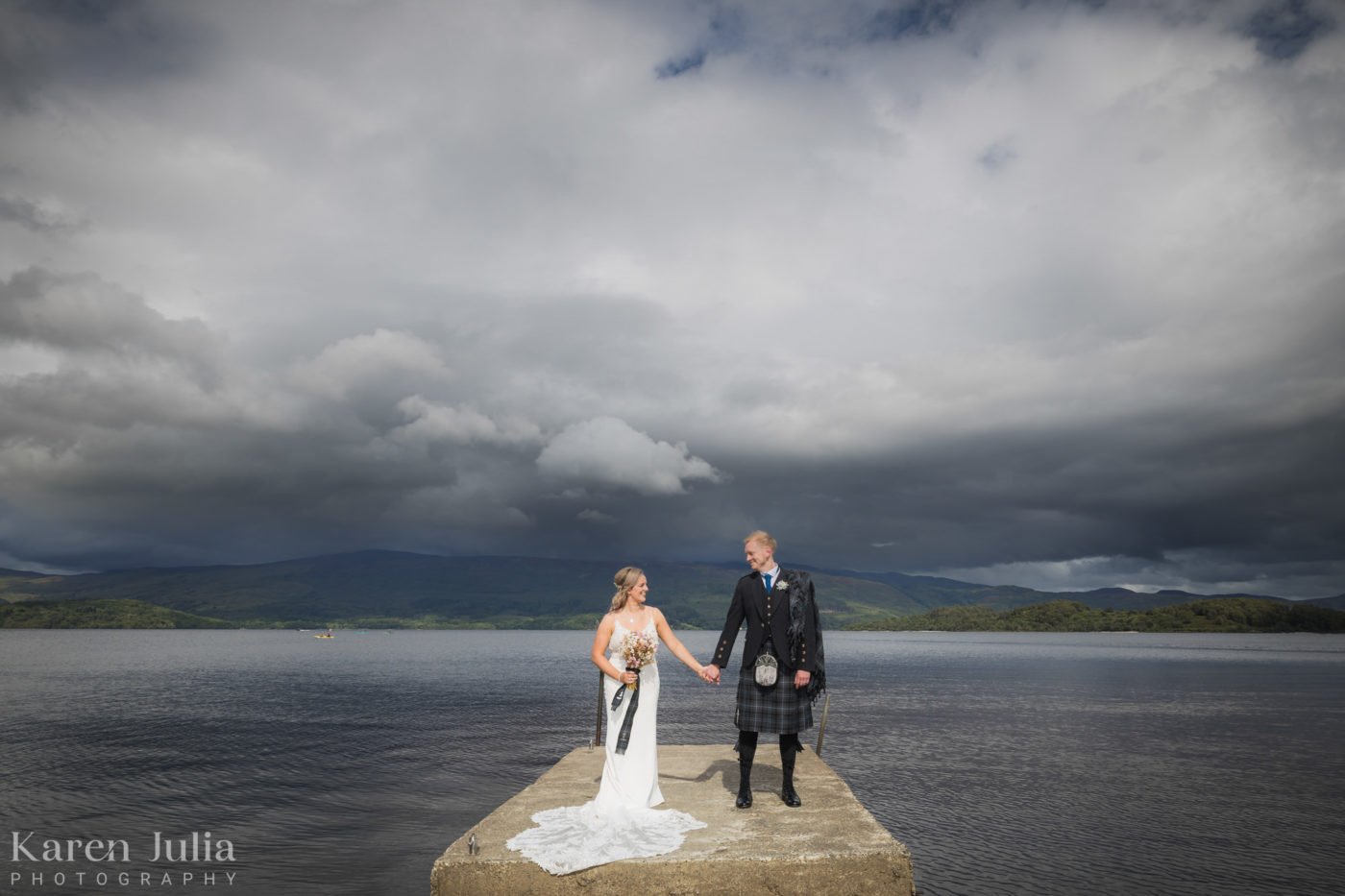 wedding day couple portrait at Luss waterfront in Loch Lomond