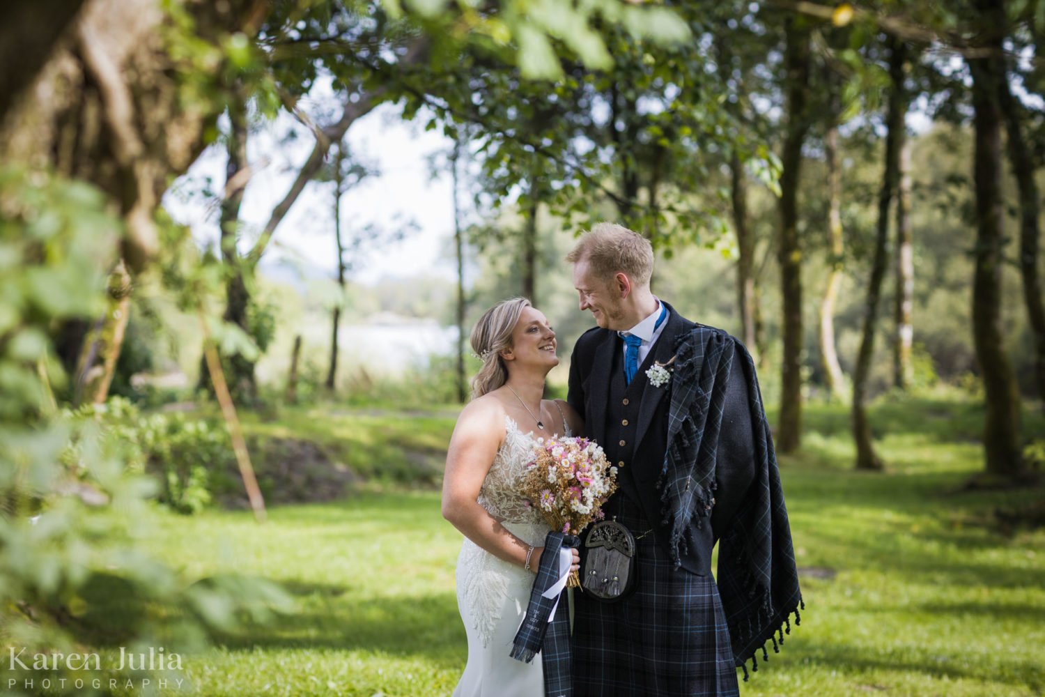 bride and groom portrait in Luss, Loch Lomond on their wedding day