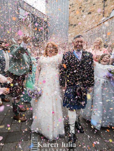 bride and groom showered with confetti at Maryhill Burgh Halls