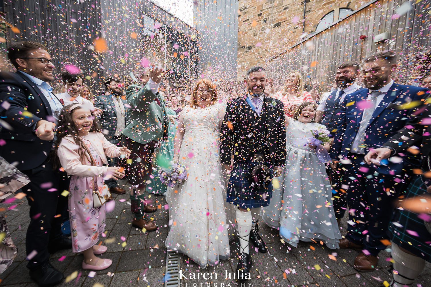 bride and groom showered with confetti at Maryhill Burgh Halls