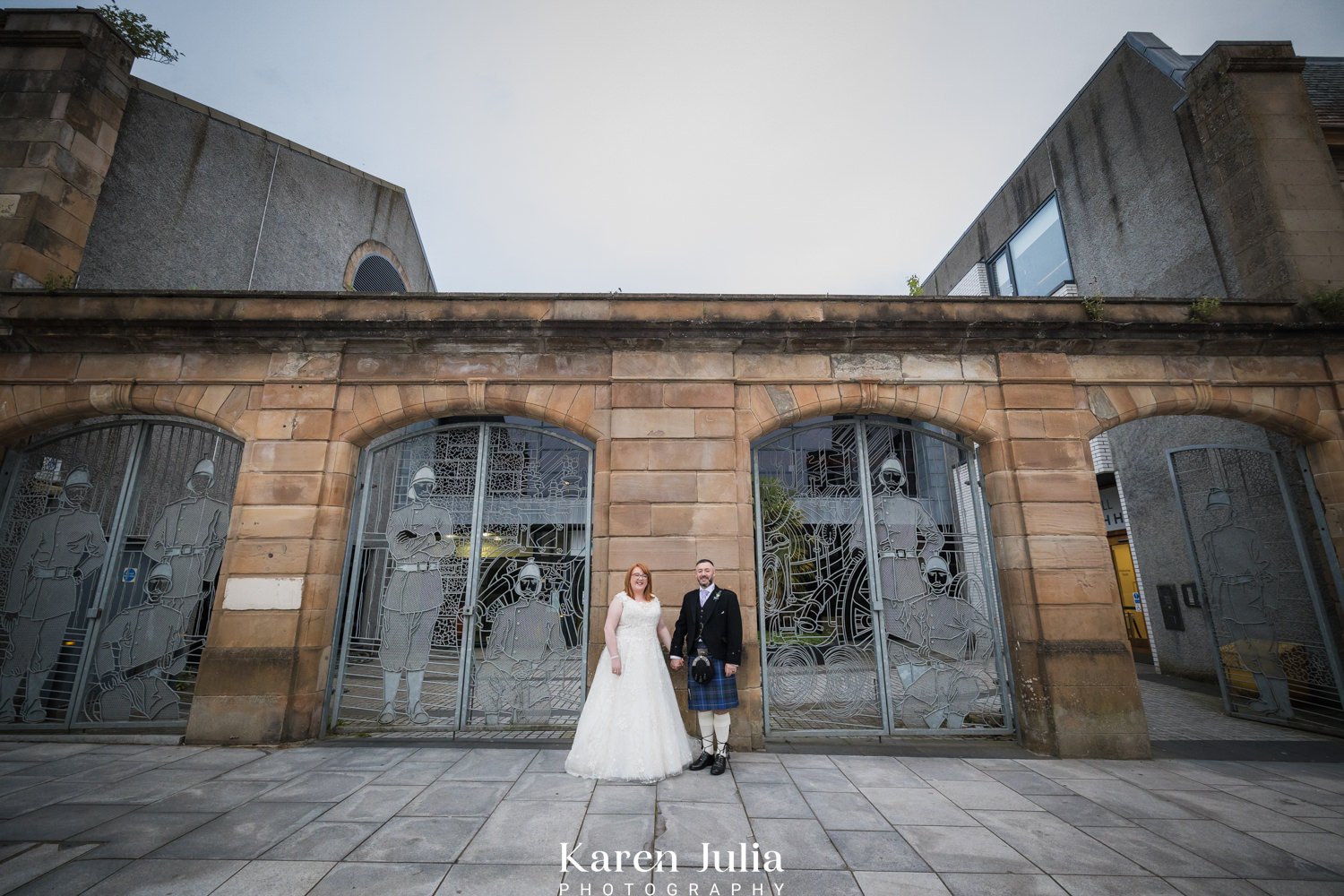 bride and groom portrait at the main entrance to the venue during their Maryhill Burgh Halls wedding photography