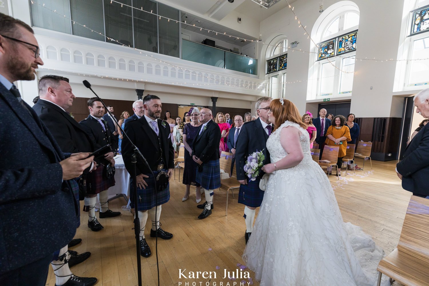 brides dad gives her a hg and a kiss before the start of the wedding ceremony