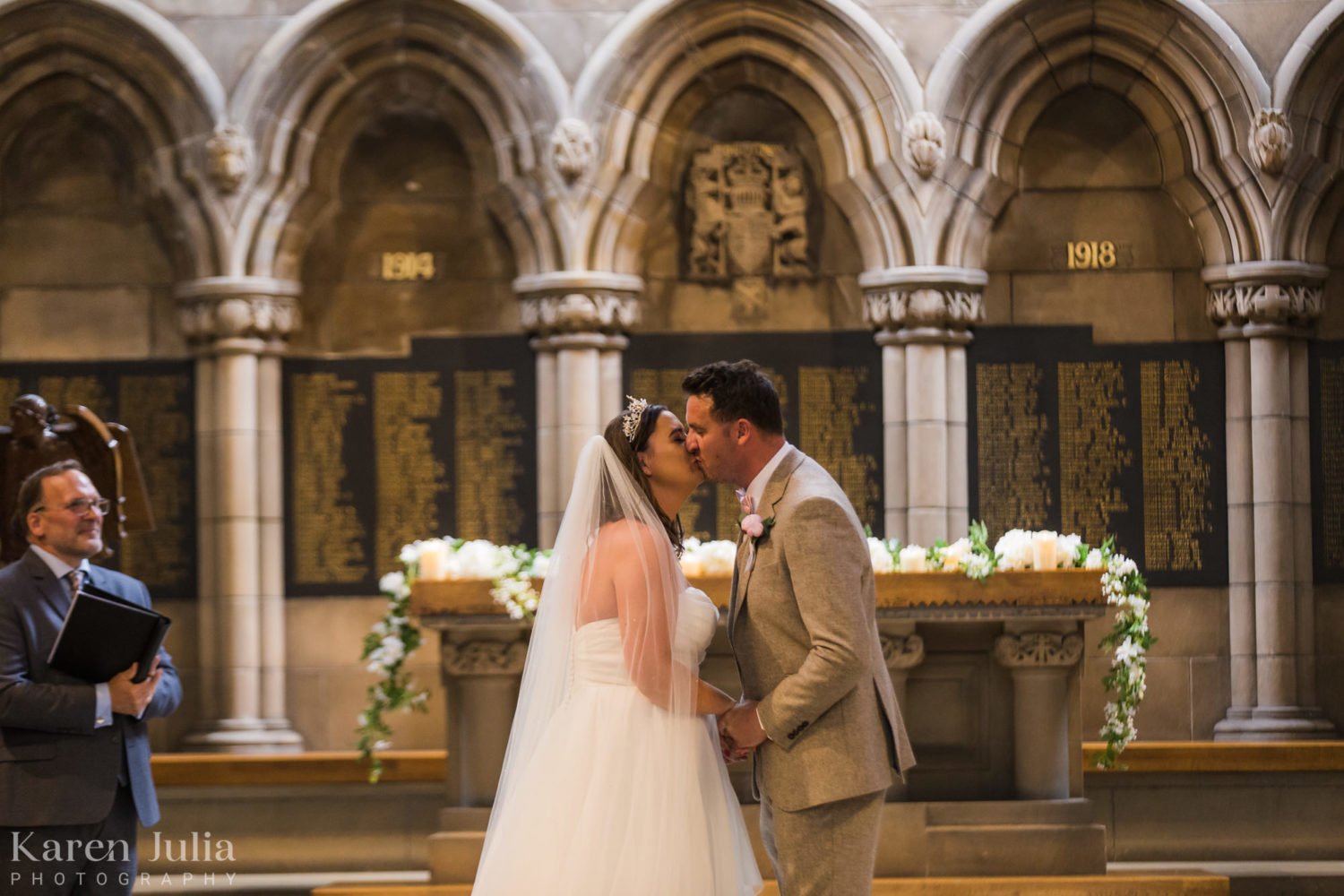 bride and groom share a kiss at the end of their wedding ceremony