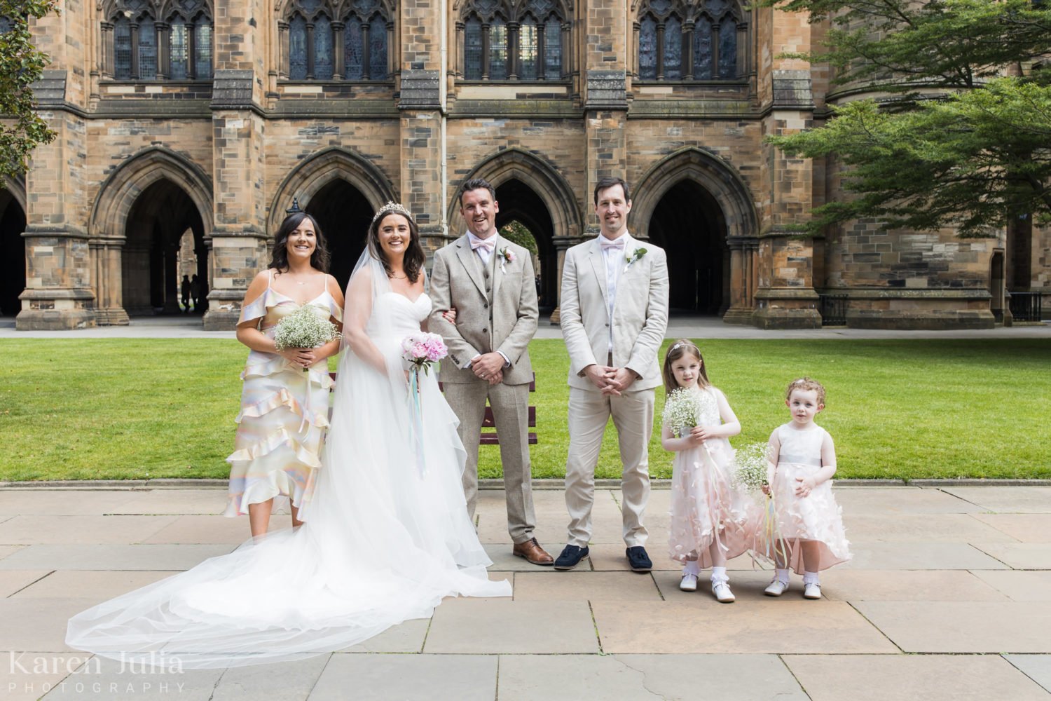 Wedding party group photo in the Quadrangle at University of Glasgow