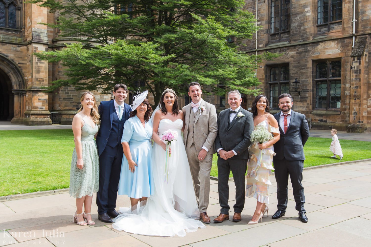 Wedding party group photo in the Quadrangle at University of Glasgow