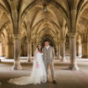 bride and groom in the cloisters during their university of Glasgow wedding photography