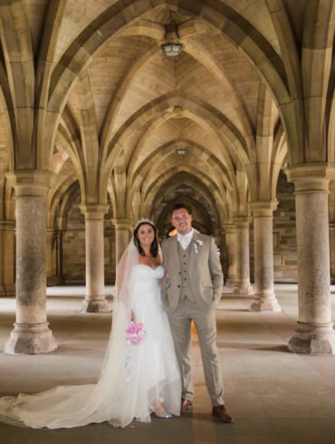 bride and groom in the cloisters during their university of Glasgow wedding photography