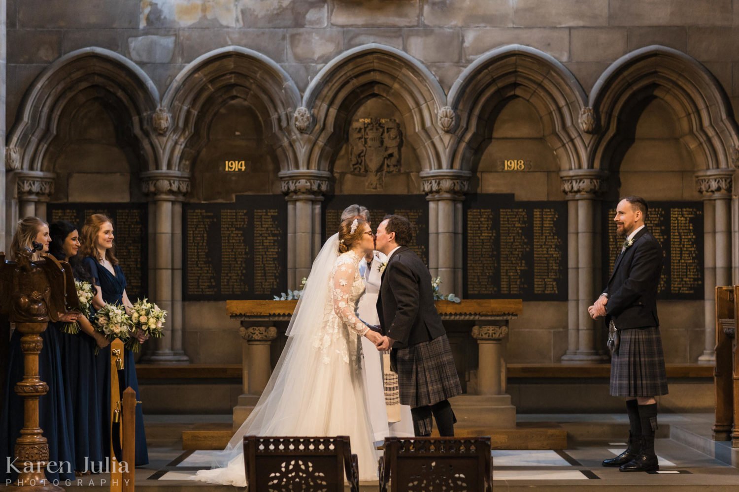 bride and groom exchange a kiss at the end of their wedding ceremony in the Memorial Chapel