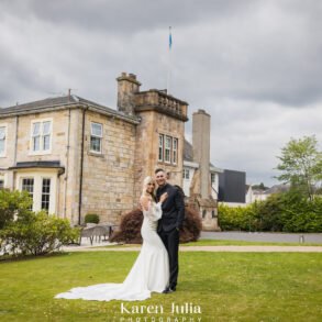 bride and groom portrait in front of Dalmeny Park House Hotel on their wedding day